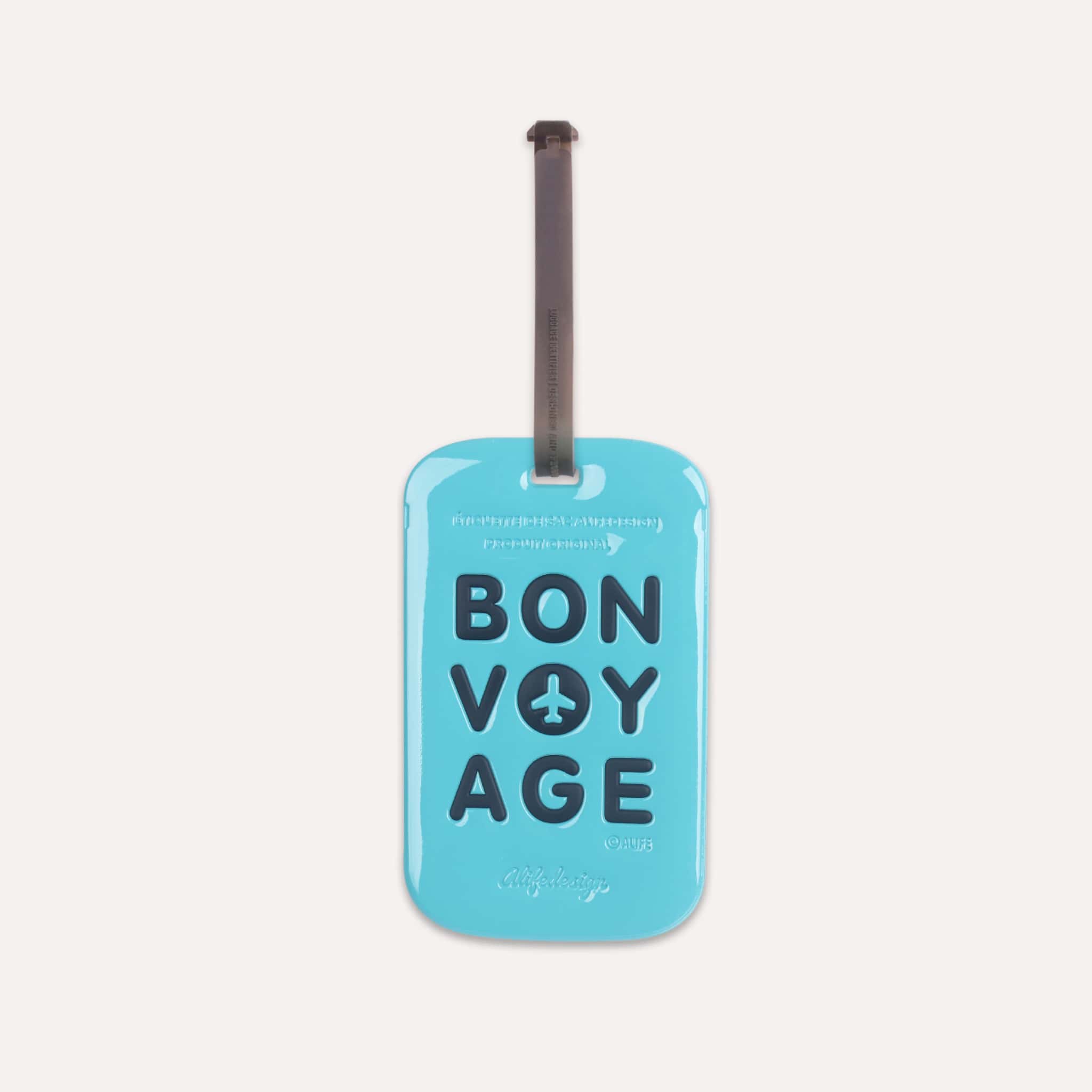 Étiquette bagage Bon Voyage Tag Bleue de ALIFE DESIGN. Un accessoire de voyage moderne, pratique et coloré. Reconnaissez votre valise en un clin d'oeil.