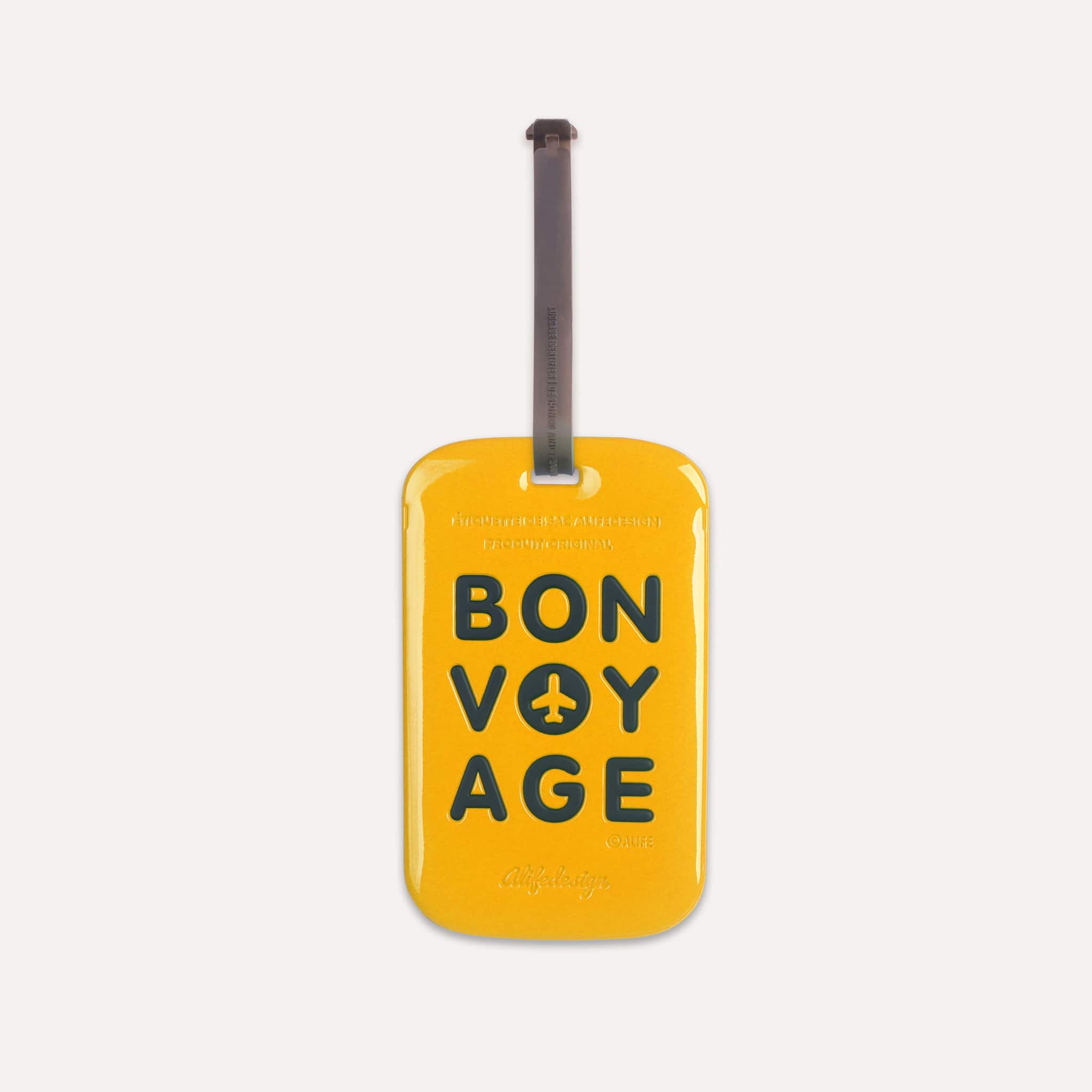 Étiquette bagage Bon Voyage Tag Jaune de ALIFE DESIGN. Un accessoire de voyage moderne, pratique et coloré. Reconnaissez votre valise en un clin d'oeil.