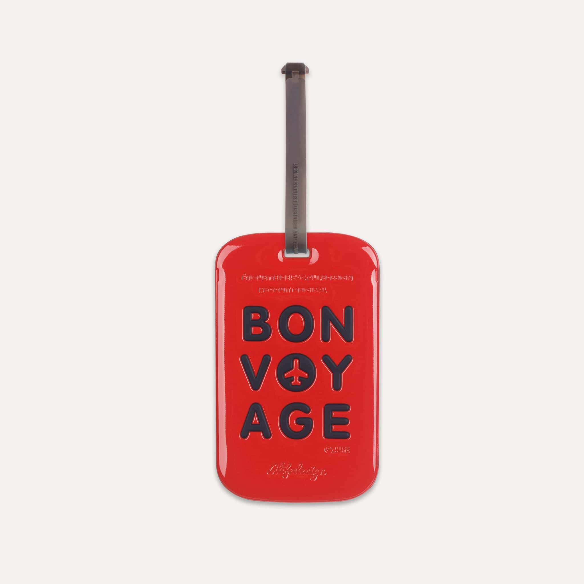 Étiquette bagage Bon Voyage Tag Rouge de ALIFE DESIGN. Un accessoire de voyage moderne, pratique et coloré. Reconnaissez votre valise en un clin d'oeil.
